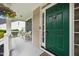 Charming front porch with a beautiful green front door and decorative hanging plants at 4608 Regency Dr, Durham, NC 27713
