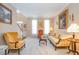 Inviting living area with large windows, comfortable seating, and elegant decor creating a welcoming atmosphere at 4608 Regency Dr, Durham, NC 27713