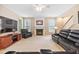 Cozy living room with a fireplace, windows, and staircase at 4608 Regency Dr, Durham, NC 27713