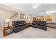 Living room with staircase and open plan to kitchen at 4608 Regency Dr, Durham, NC 27713