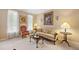 Cozy living room with elegant furnishings, including a patterned sofa, accent chair, and decorative lamps at 4608 Regency Dr, Durham, NC 27713