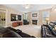 Comfortable living room with fireplace, TV, and views to the yard at 4608 Regency Dr, Durham, NC 27713