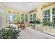 Bright sunroom with multiple windows and access to an outdoor deck at 4608 Regency Dr, Durham, NC 27713