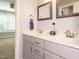 Neutral toned bathroom featuring a double sink vanity with gray cabinets, and marble countertop at 49 Mount Joy Pl, Sanford, NC 27330