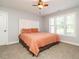Cozy bedroom featuring a full bed, neutral carpet, and shuttered windows for plenty of light at 49 Mount Joy Pl, Sanford, NC 27330