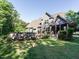 Exterior view of a home with lush landscaping, an above ground pool and an outdoor deck area at 49 Mount Joy Pl, Sanford, NC 27330