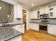 Well-equipped kitchen with stainless steel appliances, granite countertops, and ample cabinet space at 49 Mount Joy Pl, Sanford, NC 27330