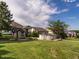 Expansive backyard with above-ground pool, playhouse, and lush green lawn, perfect for outdoor activities at 506 Wildwood Ln, Graham, NC 27253