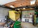 Unfinished basement used as a workshop area, complete with a workbench and tool storage at 506 Wildwood Ln, Graham, NC 27253