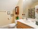 Bright bathroom features a modern sink, toilet, mirror and decor at 506 Wildwood Ln, Graham, NC 27253