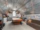 Finished bonus room with a pool table and a unique corrugated metal ceiling at 506 Wildwood Ln, Graham, NC 27253