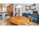 Charming breakfast nook featuring a wood table, seating, an ornate hutch, and modern lighting at 506 Wildwood Ln, Graham, NC 27253