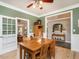 Elegant dining room with hardwood floors and connections to other living spaces at 506 Wildwood Ln, Graham, NC 27253