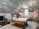 Large game room with a pool table, decor, trophies, and a unique corrugated metal ceiling at 506 Wildwood Ln, Graham, NC 27253