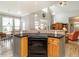 Spacious kitchen with an open plan featuring an oven, hardwood floors, and access to the backyard at 506 Wildwood Ln, Graham, NC 27253