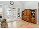 Bright living room featuring hardwood floors, a vaulted ceiling, and built-in shelves at 506 Wildwood Ln, Graham, NC 27253