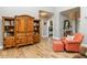 Open-concept living room with wood floors and seamless flow to other rooms at 506 Wildwood Ln, Graham, NC 27253
