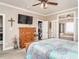 Spacious main bedroom with a closet, a large TV, and an ensuite bathroom at 506 Wildwood Ln, Graham, NC 27253