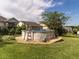 Backyard with above ground pool, brick retaining wall, chair, and lush lawn at 506 Wildwood Ln, Graham, NC 27253