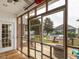 Screened porch offering views of a well-maintained backyard and inviting outdoor space, perfect for relaxing at 506 Wildwood Ln, Graham, NC 27253