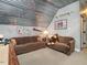Cozy sitting area featuring couches and fun decor in a bonus room with unique ceiling at 506 Wildwood Ln, Graham, NC 27253