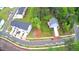 An aerial view of a charming house in a well-landscaped neighborhood with tree-lined streets at 509 Olive Branch Rd, Durham, NC 27703