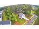 Charming, light-blue two-story home featuring a spacious yard with lush landscaping and a private deck at 509 Olive Branch Rd, Durham, NC 27703