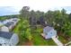 Charming light-blue, two-story house with a spacious yard surrounded by lush landscaping and trees at 509 Olive Branch Rd, Durham, NC 27703