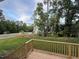 Backyard view from deck, including a grassy area and trees at 509 Olive Branch Rd, Durham, NC 27703