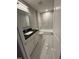 Well-lit bathroom featuring a vanity with a dark countertop, white cabinets, and a shower-tub combination at 509 Olive Branch Rd, Durham, NC 27703