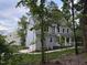 New construction home with board and batten siding in a wooded setting at 509 Olive Branch Rd, Durham, NC 27703