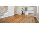 Open-concept kitchen features white cabinets and stainless steel appliances at 509 Olive Branch Rd, Durham, NC 27703