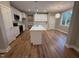 Spacious kitchen featuring white cabinets, an island with sink, and stainless steel appliances at 509 Olive Branch Rd, Durham, NC 27703