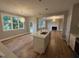 Open concept kitchen featuring a center island with a sink and an adjacent living room at 509 Olive Branch Rd, Durham, NC 27703