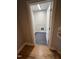 Functional laundry room with tile flooring, washer/dryer hookups, and ample space for laundry tasks at 509 Olive Branch Rd, Durham, NC 27703