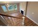 Open living room featuring a fireplace, hardwood floors, and large windows at 509 Olive Branch Rd, Durham, NC 27703