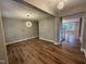 Spacious living room with hardwood flooring, modern lighting fixtures, and an open layout for comfortable living at 509 Olive Branch Rd, Durham, NC 27703