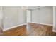 Spacious living room with wood floors, neutral walls, and modern lighting at 509 Olive Branch Rd, Durham, NC 27703