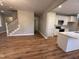 Open concept living space with hardwood floors, staircase, and modern finishes at 509 Olive Branch Rd, Durham, NC 27703