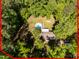 Aerial view of a home with a backyard pool, all enclosed in a red lot line boundary at 525 Turtle Creek Farm Rd, Apex, NC 27523