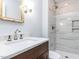 Modern bathroom featuring a single vanity and walk-in shower with designer tile at 525 Turtle Creek Farm Rd, Apex, NC 27523