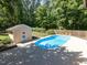 Outdoor pool with a diving board, surrounded by a concrete deck, perfect for summer relaxation at 525 Turtle Creek Farm Rd, Apex, NC 27523