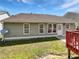 Back exterior view with a patio, well-maintained lawn, and good natural light at 5612 Tealbrook Dr, Raleigh, NC 27610