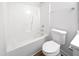 Clean and minimalist bathroom featuring a shower-tub combination and a white toilet at 5612 Tealbrook Dr, Raleigh, NC 27610