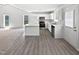 Modern kitchen with white cabinetry, stainless steel appliances, and lots of natural light at 5612 Tealbrook Dr, Raleigh, NC 27610