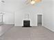 Bright living room with vaulted ceilings, a fireplace, and large windows providing great lighting at 5612 Tealbrook Dr, Raleigh, NC 27610