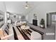 Open-concept living room with a fireplace, high ceilings, and seamlessly connected to the kitchen at 5612 Tealbrook Dr, Raleigh, NC 27610