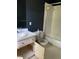 Bathroom featuring a single sink vanity and a combination tub and shower at 601 Crestview Dr, Durham, NC 27712