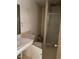 Bathroom with shower, single sink vanity and plenty of open floor space at 601 Crestview Dr, Durham, NC 27712