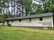 The exterior features neutral siding, set against a lush, green yard at 601 Crestview Dr, Durham, NC 27712